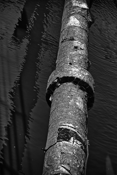 Mooring post over water