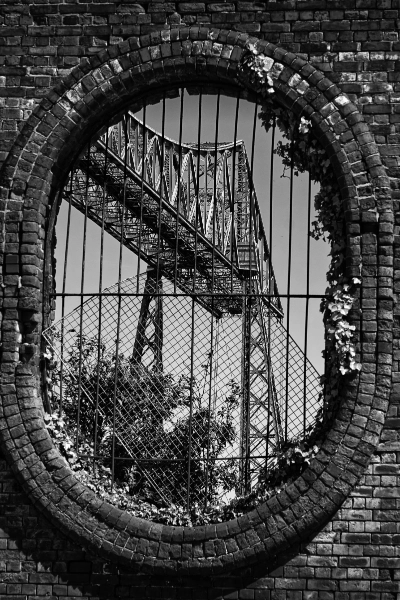 Transporter Bridge through a brick oval