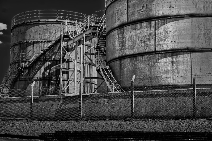 Storage tanks behind a fence