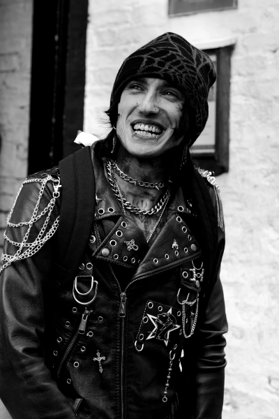 Man in studded leather, grinning